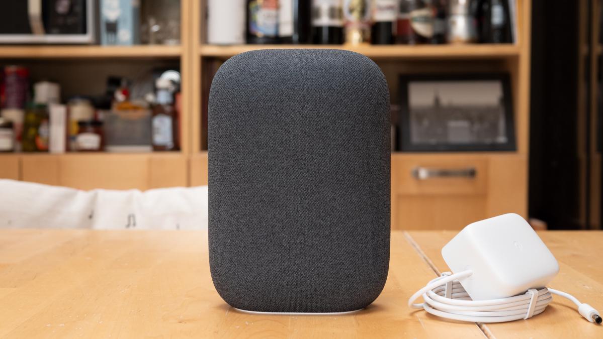 Google Nest Audio in Charcoal on a wooden table