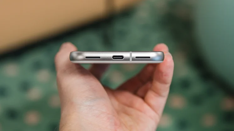 google pixel 8a review - phone held to show charging port