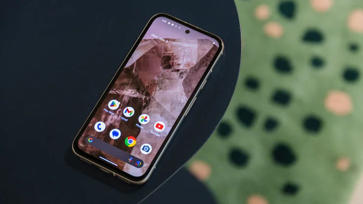 google pixel 8a review phone shown on desk with homescreen on