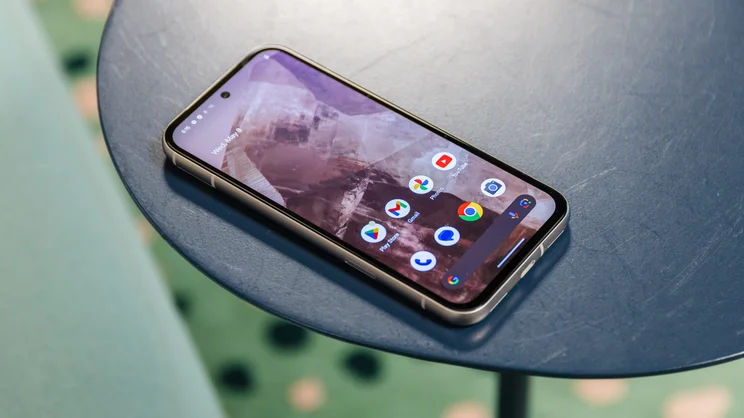 google pixel 8a review - phone with home screen on desk