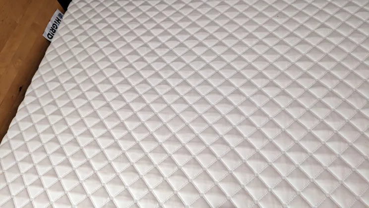HiGrid Premium Hybrid mattress close up with tag