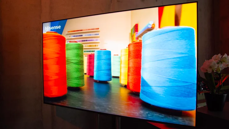The Hisense U7S Pro TV displaying several colourful spools of thread
