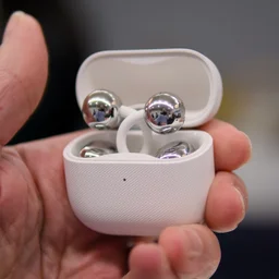 Huawei FreeClip 2 being held in hand