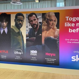 A poster at a Sky press event showcasing the new apps - Disney+, HBO Max and Hayu - that will be added to the Sky Ultimate TV package in March