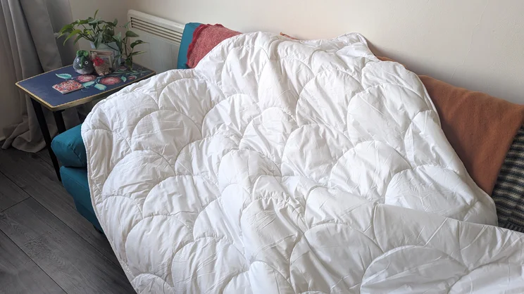 The Larke Nature's Blend duvet draped over a sofa