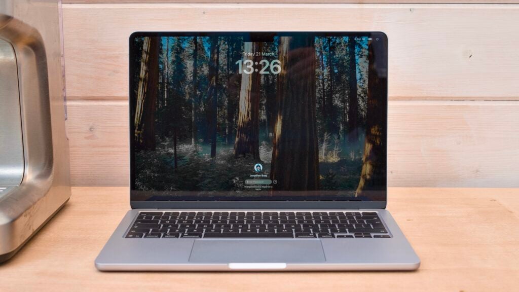 M4 MacBook Air pictured from the front on a wood workbench