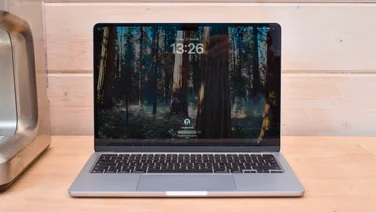 M4 MacBook Air pictured from the front on a wood workbench