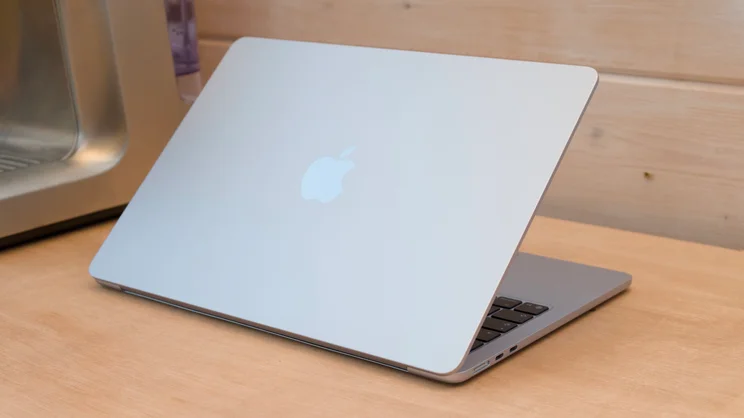 M4 MacBook Air pictured from the rear at an angle on a wood workbench