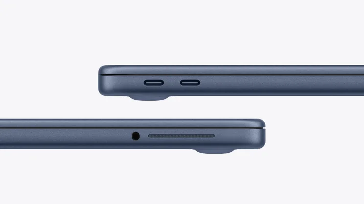 A render of the Apple MacBook Neo in indigo showing the ports in close up