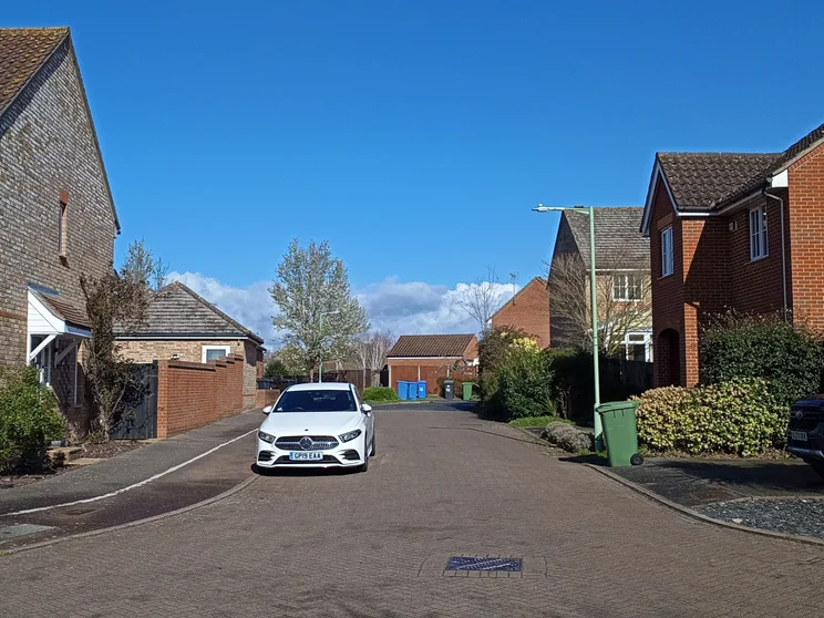 A quiet street with houses on both sides