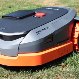 The Segway Navimow X350E, sitting on a lawn, shot from the front left corner