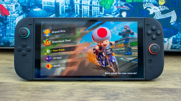 Nintendo Switch 2 propped up in table mode, with a Mario game on the display