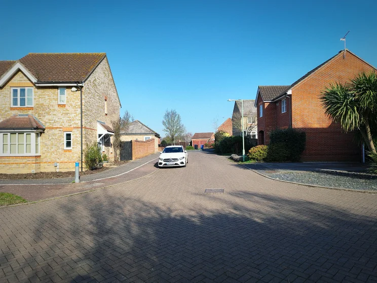 A quiet road with houses on both sides
