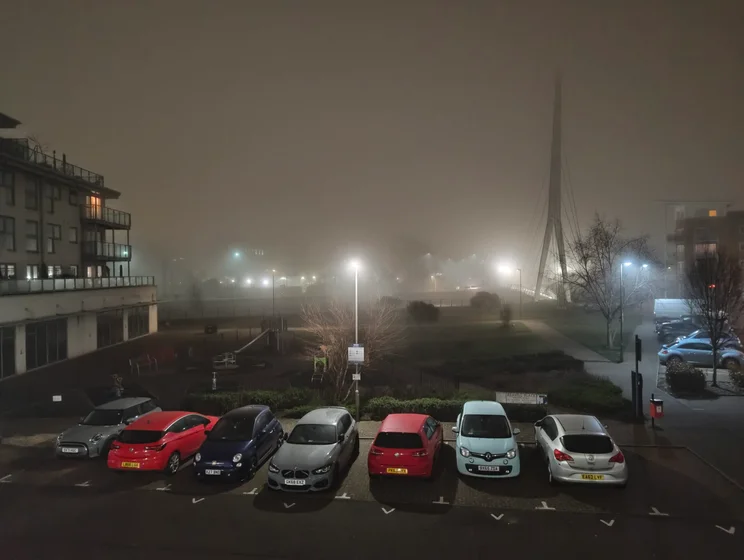 A car park on a foggy night