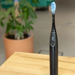 The Oclean X Pro 20 toothbrush on a table in an office