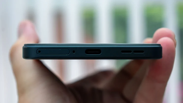 OnePlus Nord CE 5 in hand, showing the bottom edge and charging port