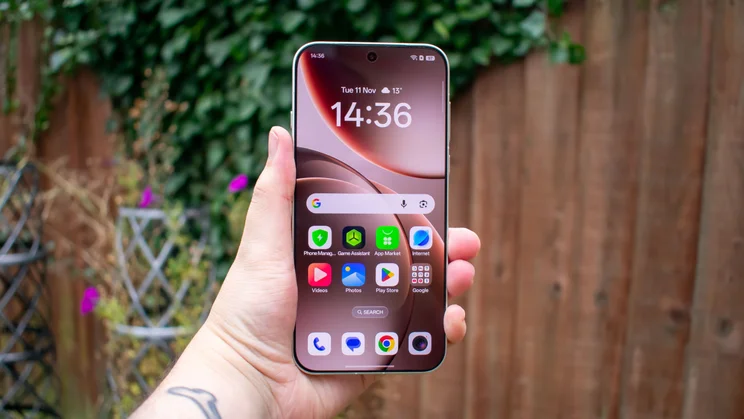 Oppo Find X9 Pro in hand, front view