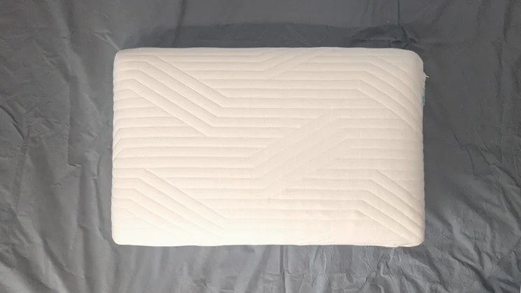 An aerial view of the Origin Coolmax Latex pillow, on a mattress