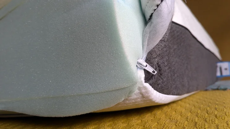 The edge of the Panda Hybrid Bamboo mattress with the cover unzipped