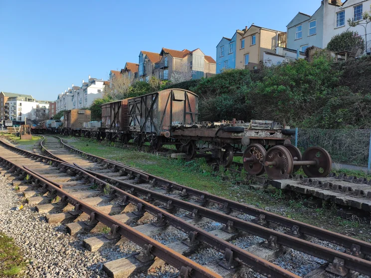 Quiet train tracks with a train stopped