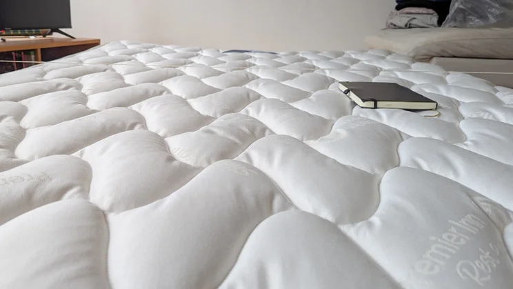 Premier Inn 2.0 Mattress review view of padded mattress top with note pad on it