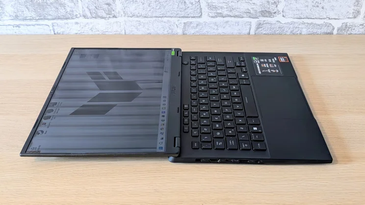 The Asus TUF Gaming A14 RTX 5060 laptop pictured folded flat 180 degrees