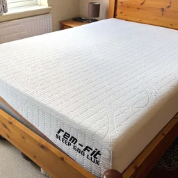 The REM-Fit 600 Lux Elite mattress on a wooden bed frame
