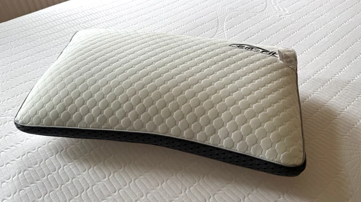 The REM-Fit Deluxe Pocket pillow on a mattress