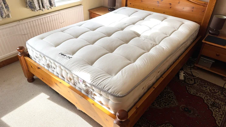 The REM-Fit Natural Lux Hybrid mattress on a bed