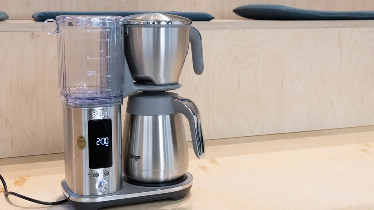 The Sage Luxe Brewer filter coffee machine on a wooden bench