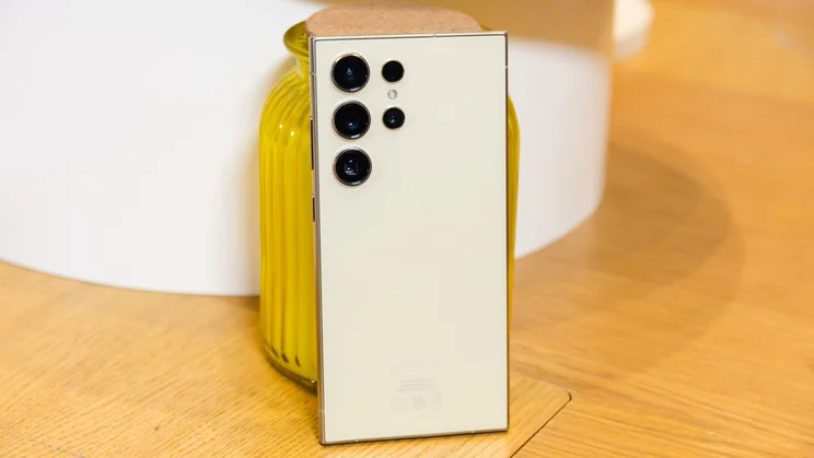 Samsung Galaxy S24 Ultra review - Phone leaning on a candle, rear view