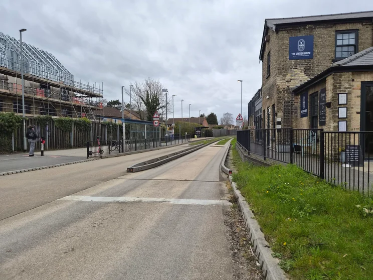 A quiet road with buildings on both sides
