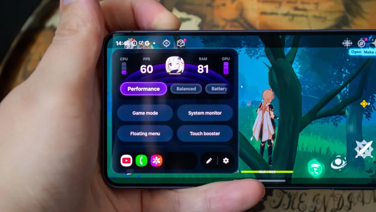 Samsung Galaxy S26 in hand, displaying a mobile game