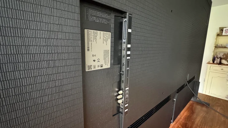 Rear view of the Samsung S99H quantum dot OLED TV showing the connection ports