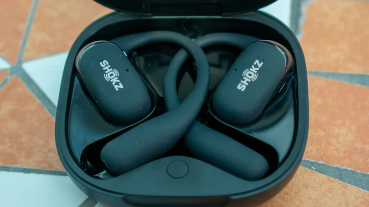Close up of the Shokz OpenFit 2 in their charging case