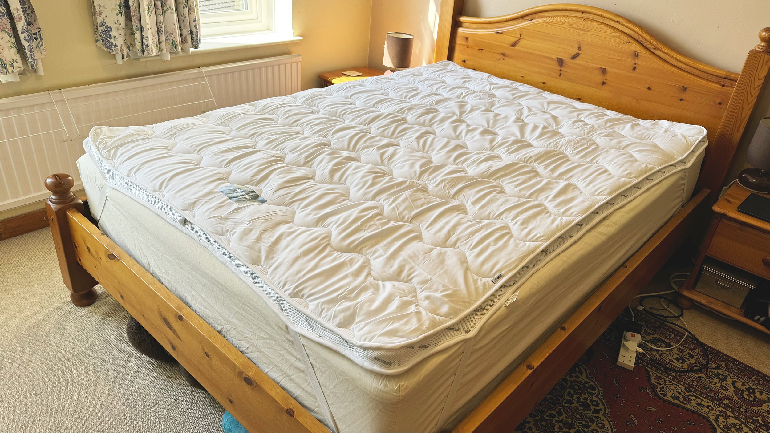 The Silentnight Airmax mattress topper on a wooden bed frame