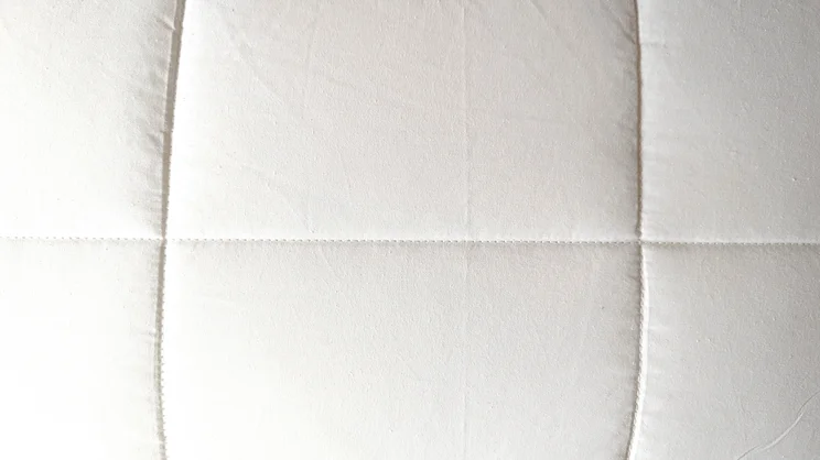 A bird's eye view of the cotton cover of the Simba Aerodown pillow