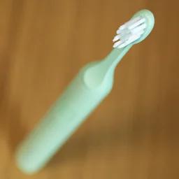 A closeup of the Suri 2.0 electric toothbrush from above