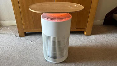 The SwitchBot air purifier with red light on