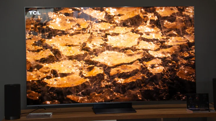 The TCL C8L SQD Mini LED TV displaying a cracked earth scene with lots of specular highlights