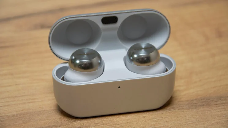 The Technics EAH-AZ100 wireless earbuds in their charging case with the lid open