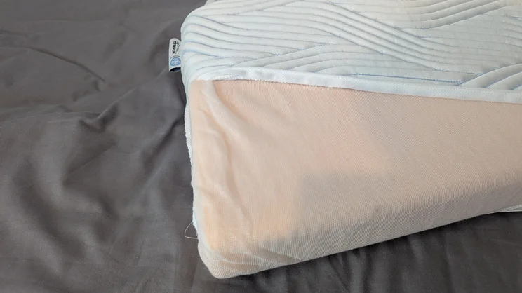 The Tempur Original SmartCool Pillow, cover unzipped and inside exposed