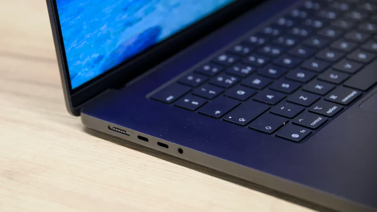 The 2026 M5 Pro MacBook Pro, open, close up on the left edge