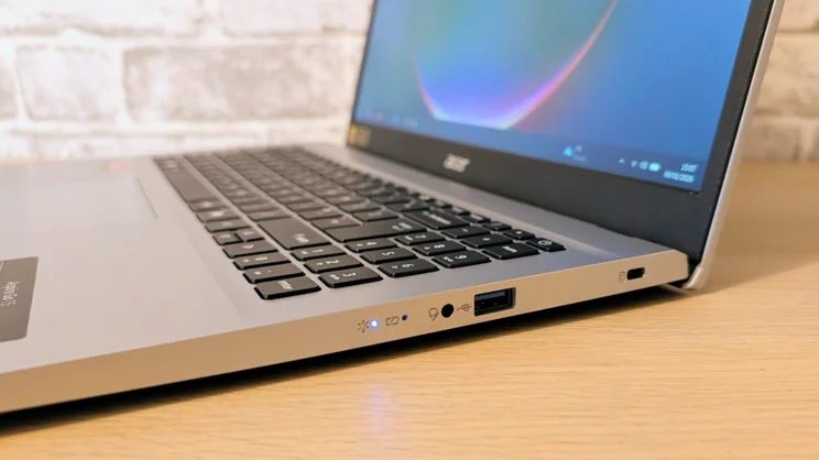 The Acer Aspire Go 15 (AG15-42P), open, pictured close up from the right edge