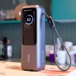 The Anker laptop power bank A1695 pictured standing on a worktop