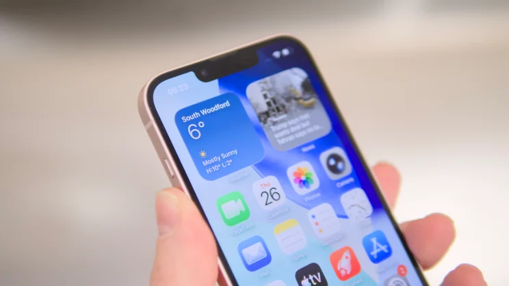 The Apple iPhone 17e pictured being held at an angle