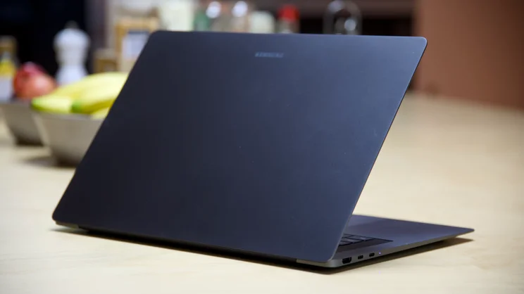 The Samsung Galaxy Book6 Pro 16 pictured, half open, on a breakfast bar