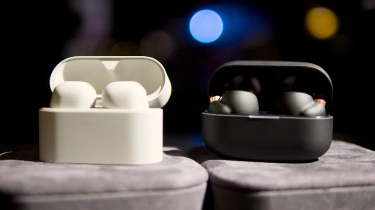 The Sony WF-1000XM6 in their case, pictured next to the WF-1000XM5