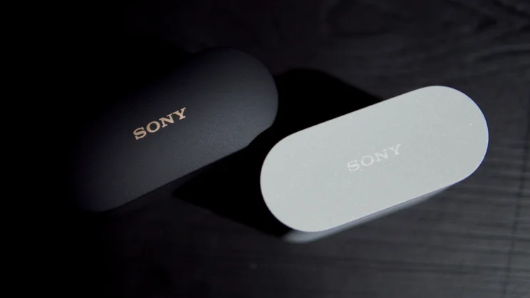 The Sony WF-1000XM6's charging case (right) pictured next to the WF-1000XM5's charging case, pictured from above