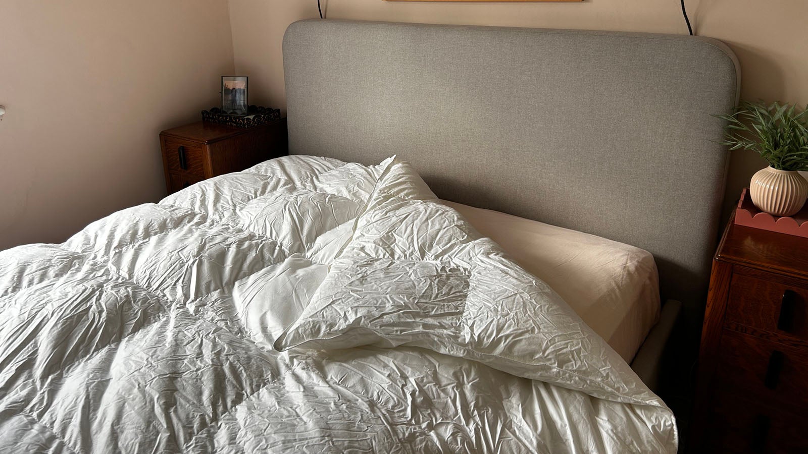 The White Company Deluxe Down Alternative duvet in a warmly lit bedroom